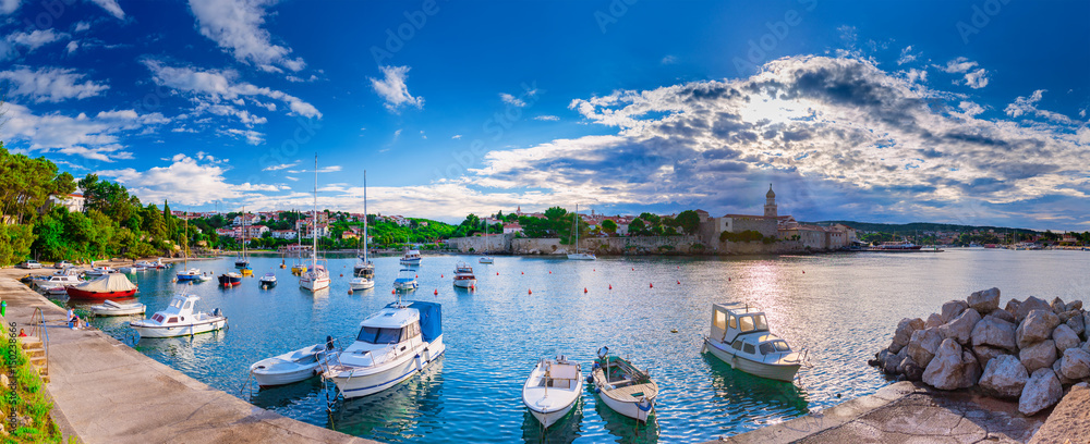 Obraz premium Wonderful romantic summer evening landscape panorama coastline Adriatic sea. Boats and yachts in harbor at cristal clear azure water. Old town of Krk on the island of Krk. Croatia. Europe.