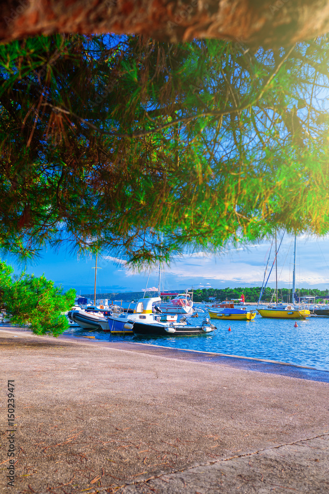 Naklejka premium Wonderful romantic summer evening landscape panorama coastline Adriatic sea. Boats and yachts in harbor at cristal clear azure water. Old town of Krk on the island of Krk. Croatia. Europe.