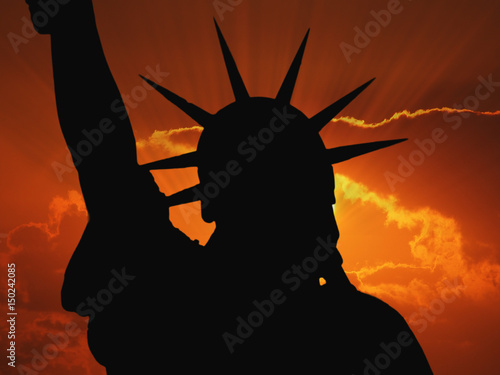 The Statue of Liberty. Silhouette at sunset