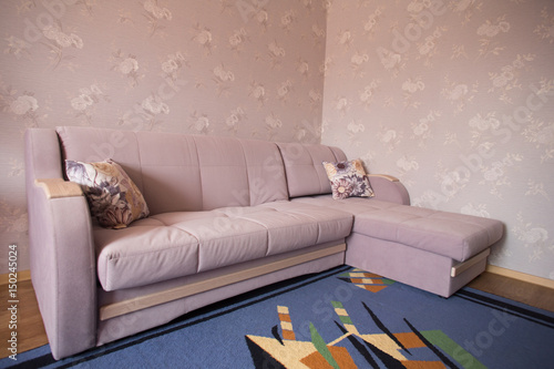 Sofa in a room with TThis photo