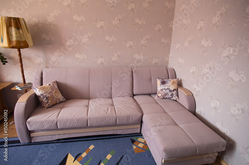 Sofa in a room with TThis photo