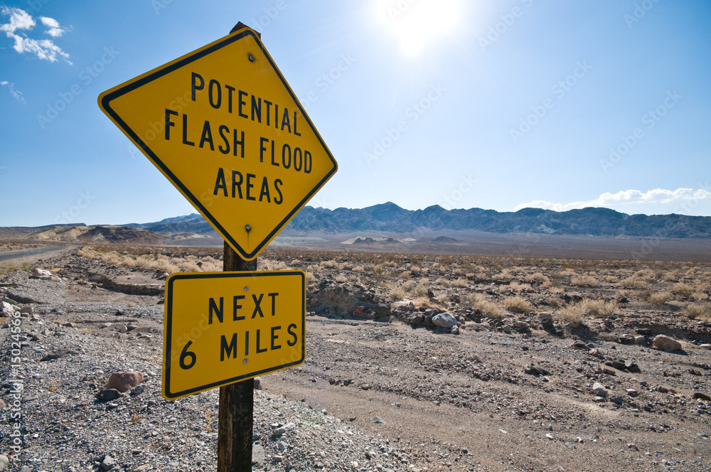 Flash flood warning sign in the desert Flash flood warning sign in the desert