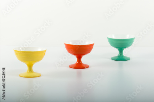 Antique dessert bowls red green and yellow isolated on white