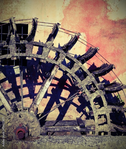 Detail of a Big wheel of an old water mill with vintage effect