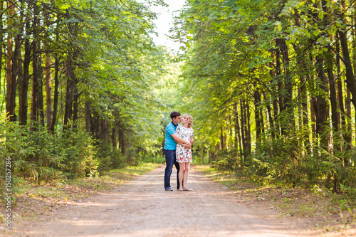 Wallpaper Mural happy young pregnant woman with her husband outdoors Torontodigital.ca