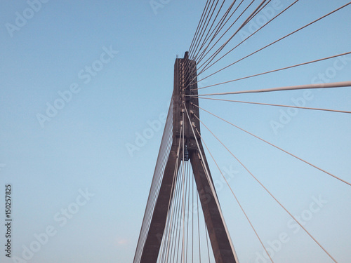 Closeup of bridge on clear blue sky