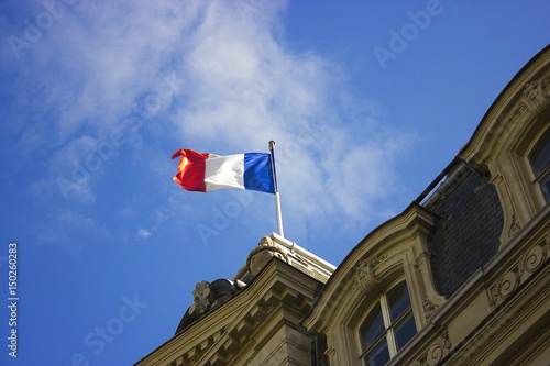 French flag waving in the air photo