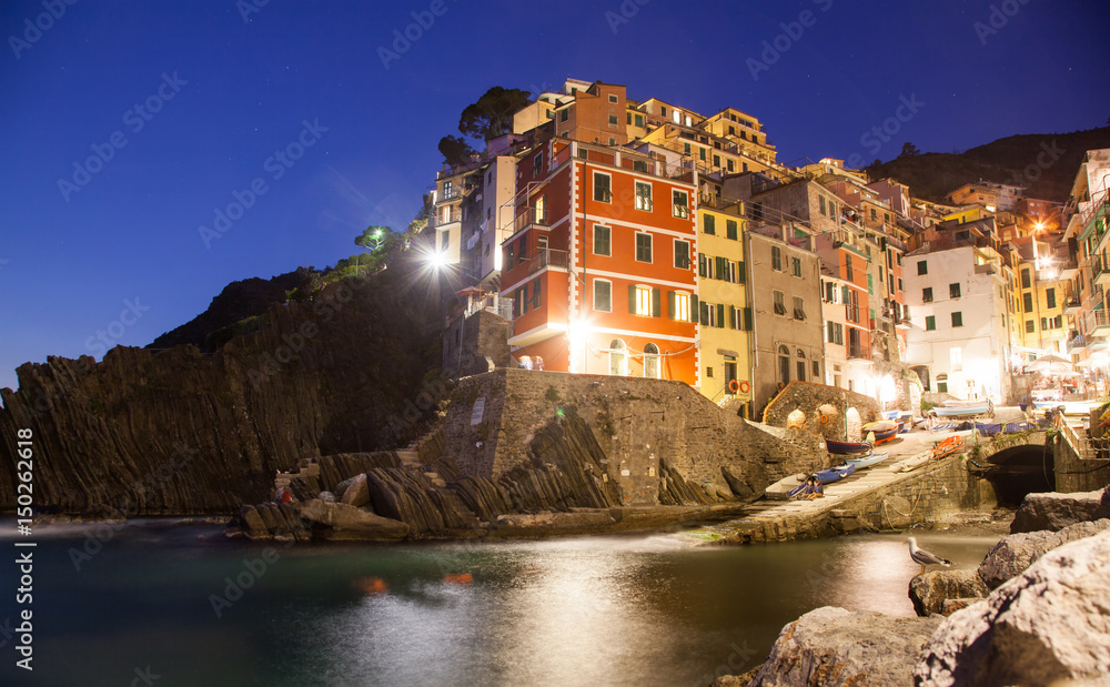 picturesque town of Riomaggiore at night in Cinque Terre National park, Liguria region, Italy