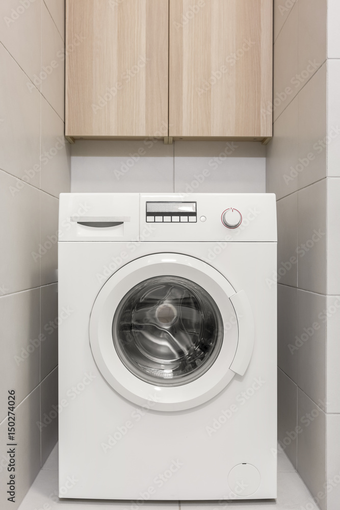 Washing machine in bathroom Washing machine in bathroom