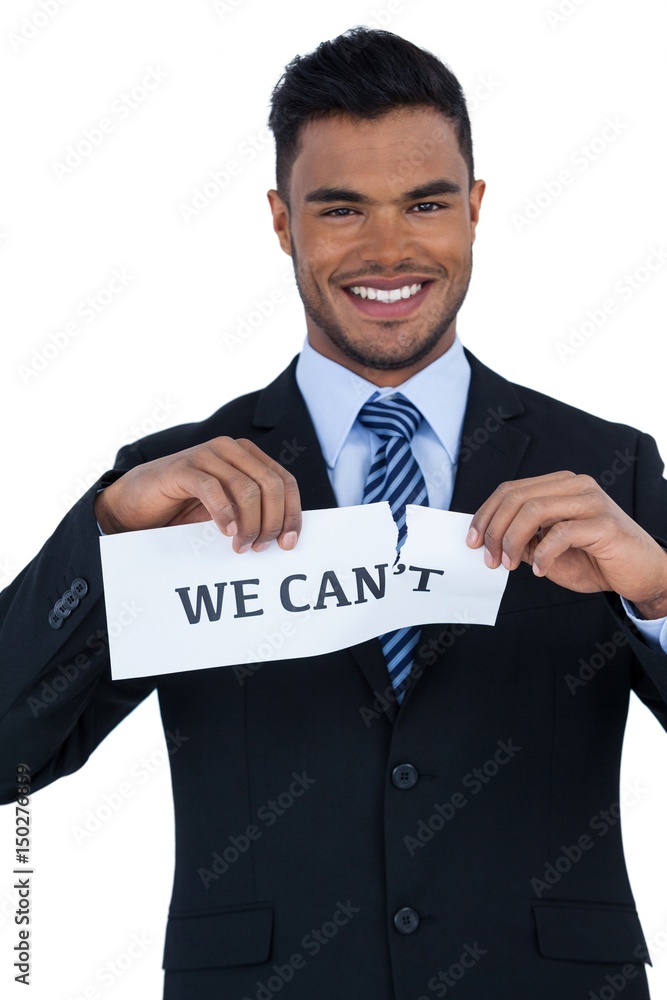 image of businessman tearing a paper image of businessman tearing a paper