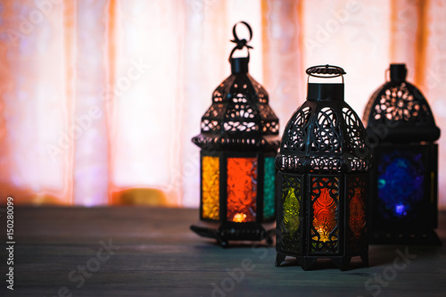 The Muslim feast of the holy month of Ramadan Kareem. Beautiful background with a shining lantern Fanus. Free space for your text.