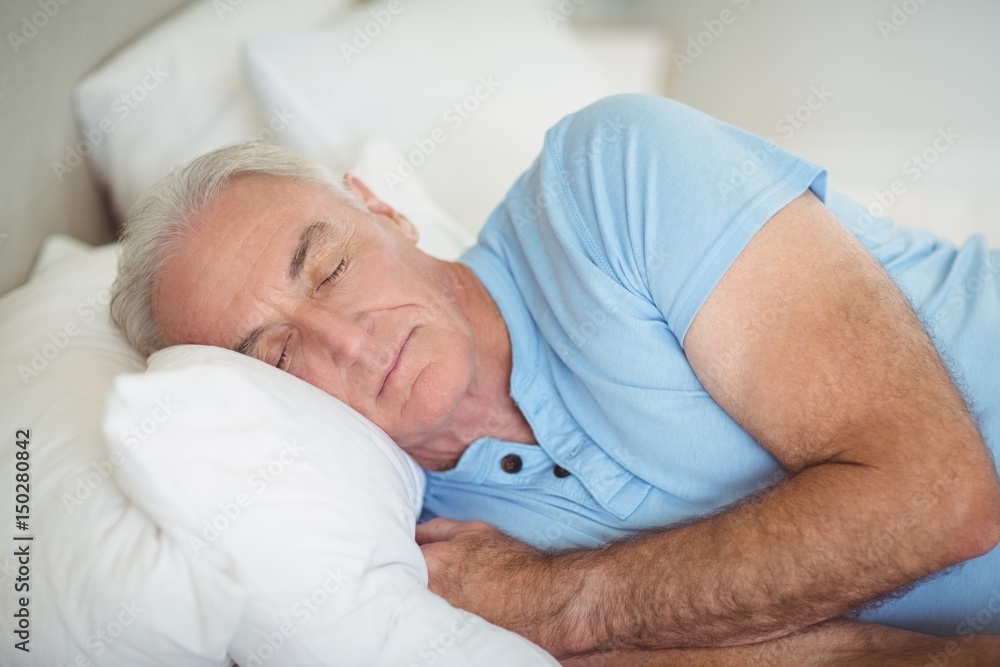 Senior man sleeping on bed Senior man sleeping on bed