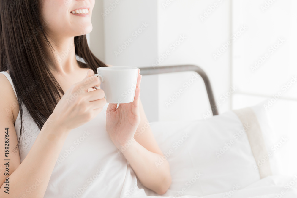 attractive asian woman relaxing in bedroom attractive asian woman relaxing in bedroom