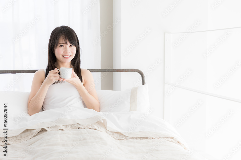attractive asian woman relaxing in bedroom attractive asian woman relaxing in bedroom