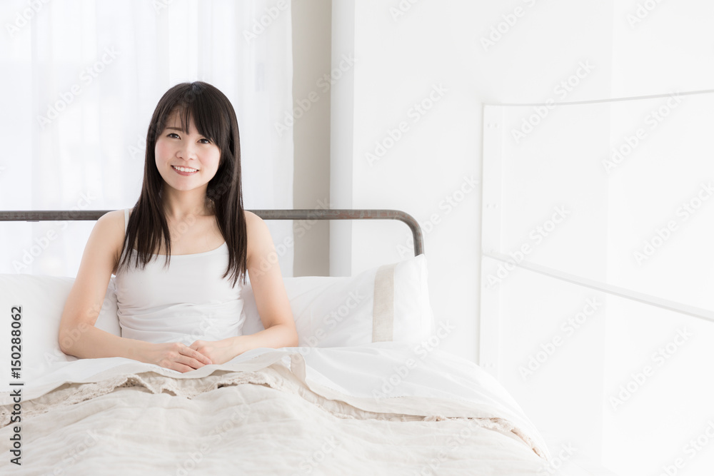 attractive asian woman relaxing in bedroom attractive asian woman relaxing in bedroom