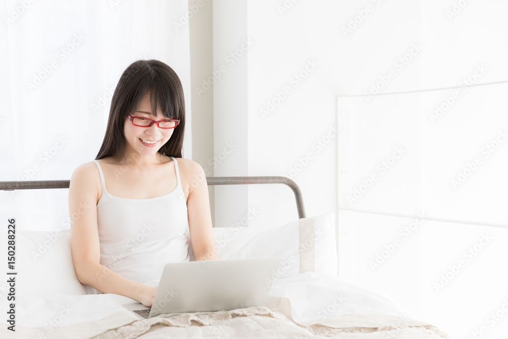 attractive asian woman relaxing in bedroom attractive asian woman relaxing in bedroom