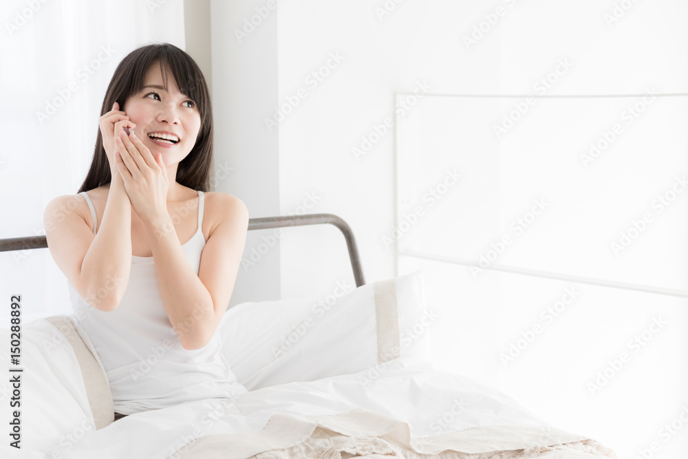 attractive asian woman relaxing in bedroom attractive asian woman relaxing in bedroom