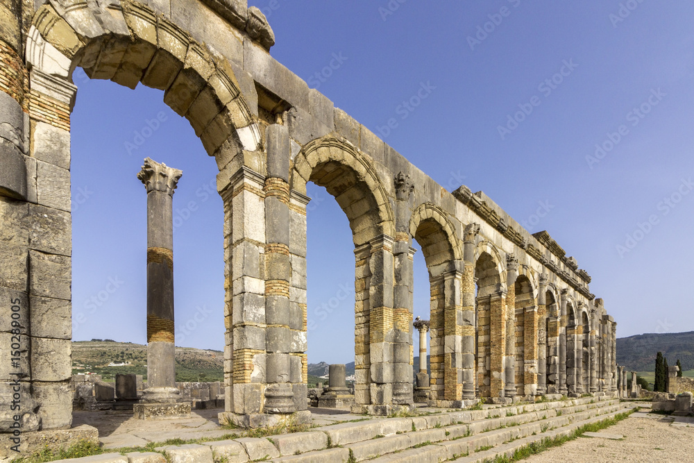 Exterior of the Basilica at archaeological Site of Volubilis, ancient Roman empire city, Unesco World Heritage Site Exterior of the Basilica at archaeological Site of Volubilis, ancient Roman empire city, Unesco World Heritage Site