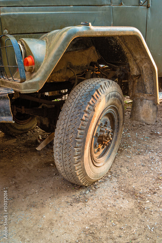 Detail of a soviet military truck vehicle tire over ground road