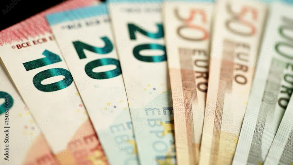 Nobody. Euro banknotes of different values. Euro cash money background. Dolly sliding shot 4K ProRes HQ codec Nobody. Euro banknotes of different values. Euro cash money background. Dolly sliding shot 4K ProRes HQ codec