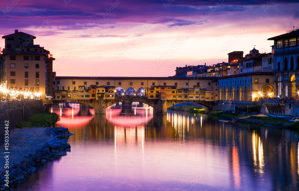 sunset above Ponte Vecchio - Old Bridge view from Arno river bank sunset above Ponte Vecchio - Old Bridge view from Arno river bank