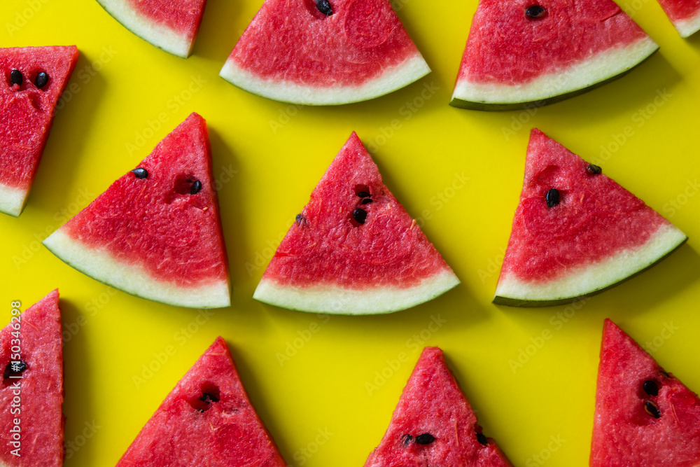 Pieces of red watermelon on yellow background. Pieces of red watermelon on yellow background.