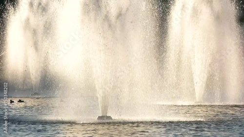 Fountains in motion. Water spalshes outdoor. photo