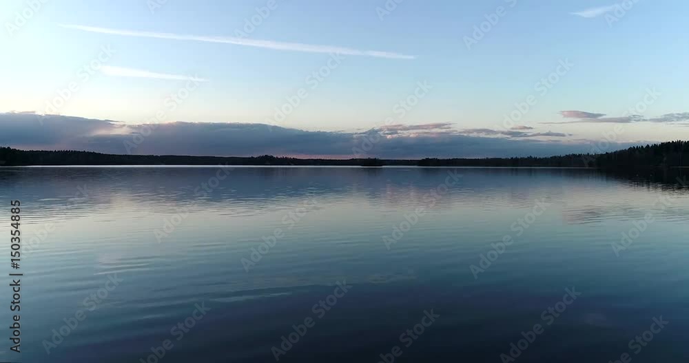 Lake bodom, Cinema 4k aerial rising view above mirroring bodom lake, on a sunny spring evening, in Espoo, Finland Lake bodom, Cinema 4k aerial rising view above mirroring bodom lake, on a sunny spring evening, in Espoo, Finland