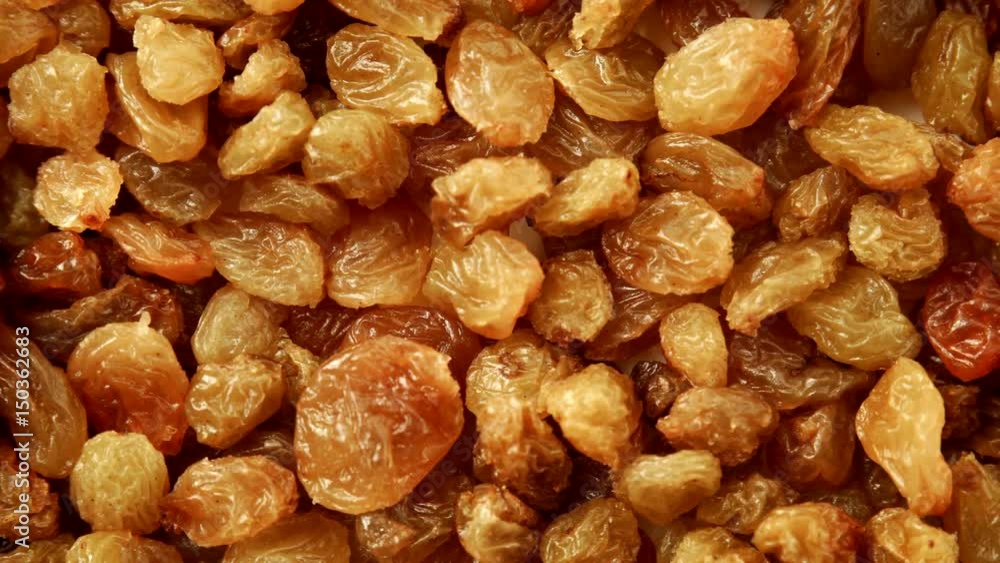 Raisin dried grape as background texture. Healthy food organic nutrition. Dolly slider shot 4K ProRes HQ codec Raisin dried grape as background texture. Healthy food organic nutrition. Dolly slider shot 4K ProRes HQ codec