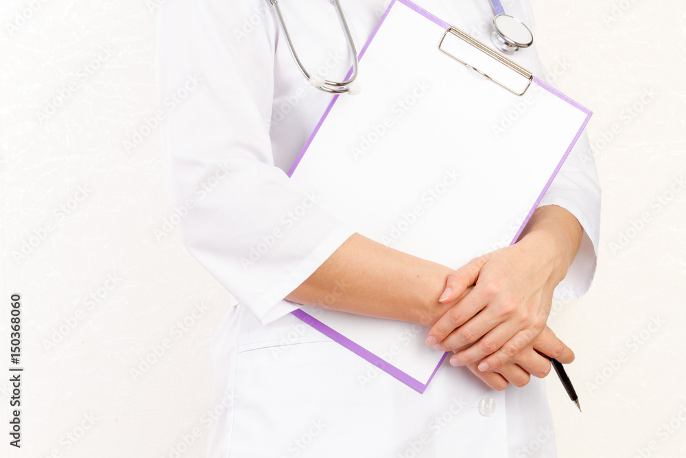 Doctor holding a tablet computer while using it isolated on white background Doctor holding a tablet computer while using it isolated on white background