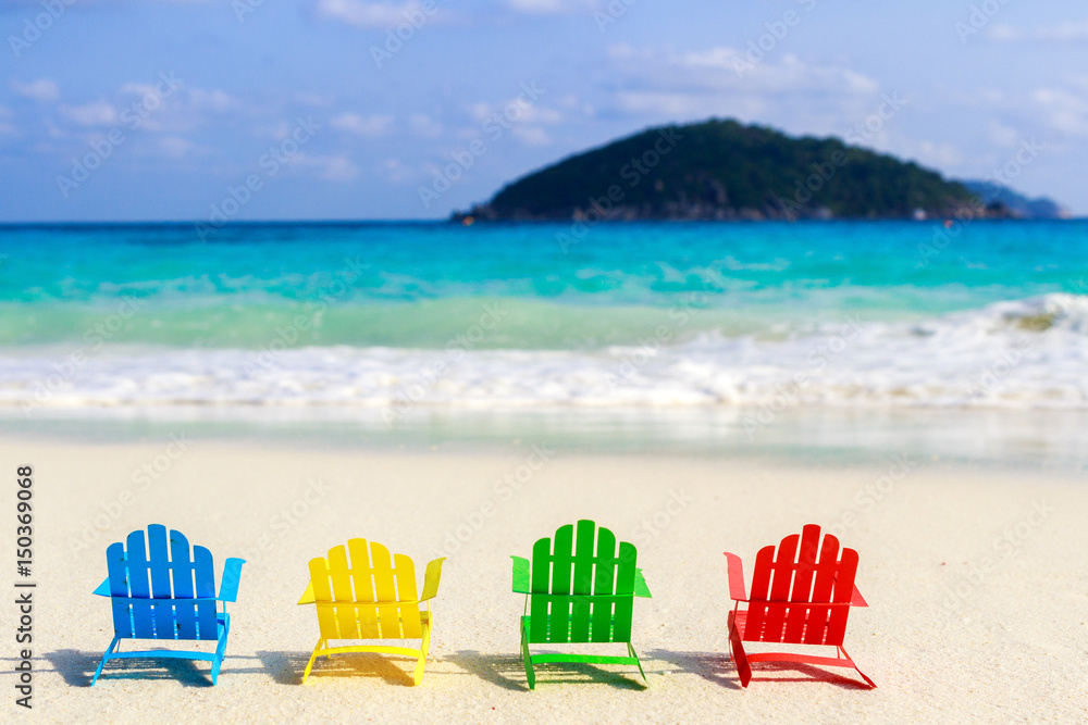 Beach chairs on the sandy beaches for tourists to sit and relax in the soft ocean waves breaking on the beach. Made of paper. Beach chairs on the sandy beaches for tourists to sit and relax in the soft ocean waves breaking on the beach. Made of paper.
