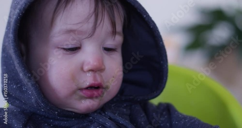 sick toddler boy with snot on face