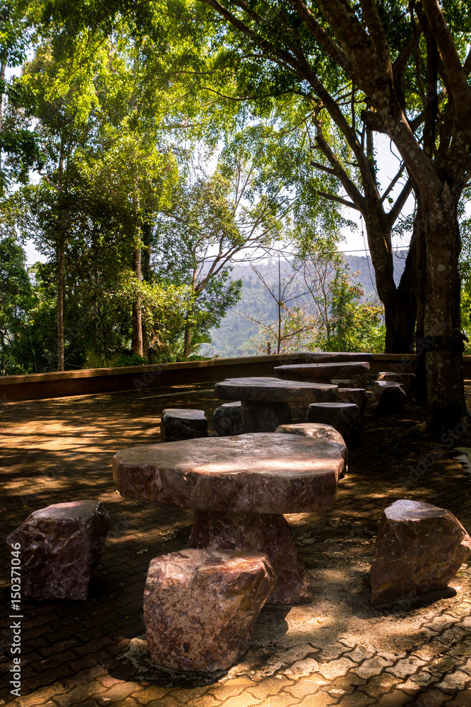 one table and chairs which is made by stone in ancient time. one table and chairs which is made by stone in ancient time.