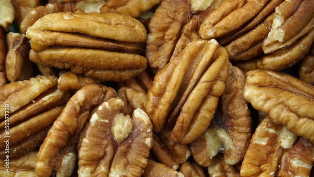 Food background. Pecan nuts close up. Dieting concept. Dolly slider shot 4K ProRes HQ codec Food background. Pecan nuts close up. Dieting concept. Dolly slider shot 4K ProRes HQ codec