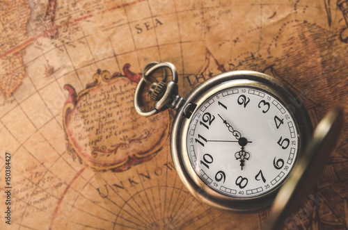 pocket watch  or pendant watch on vintage map background (watch)