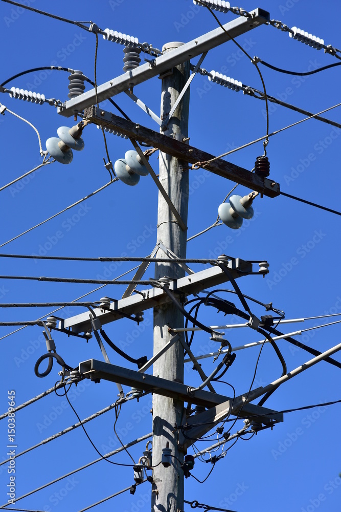 Junction of electrical wires with isolators on aged wooden pole. Stock  Photo | Adobe Stock
