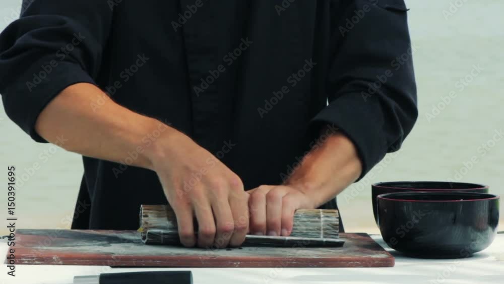Chef make sushi roll