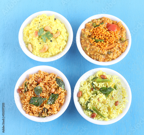 South Indian traditional and popular vegetarian rice dishes pongal, bisi bele bath, lemon rice and puliyogare.