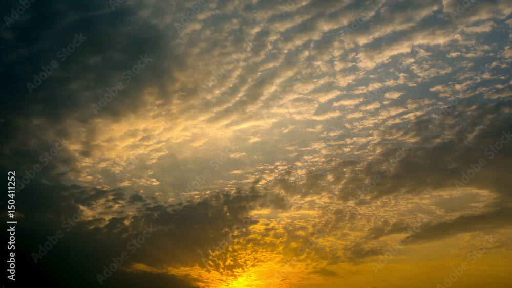 Colorful dramatic sky with cloud at Sunrise.Sky with sun background