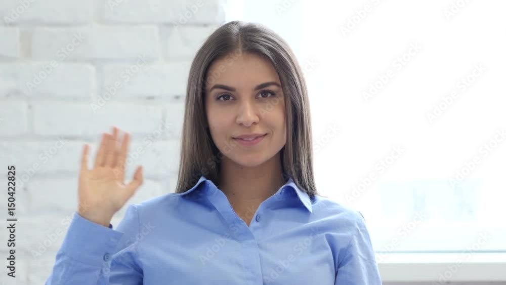 Portrait of Beautiful Young Woman Waving Hand to Welcome Portrait of Beautiful Young Woman Waving Hand to Welcome