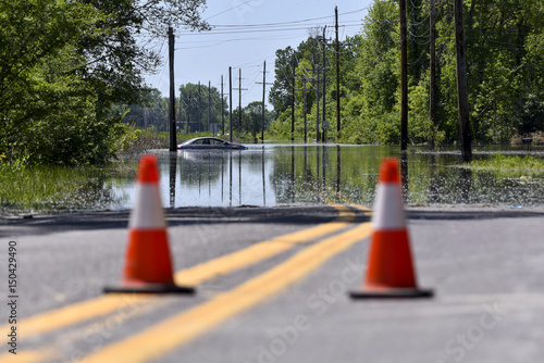 Stranded car on a flooded road