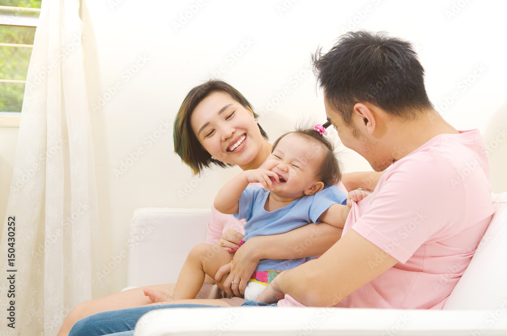 Asian parent playing with their baby at home Asian parent playing with their baby at home