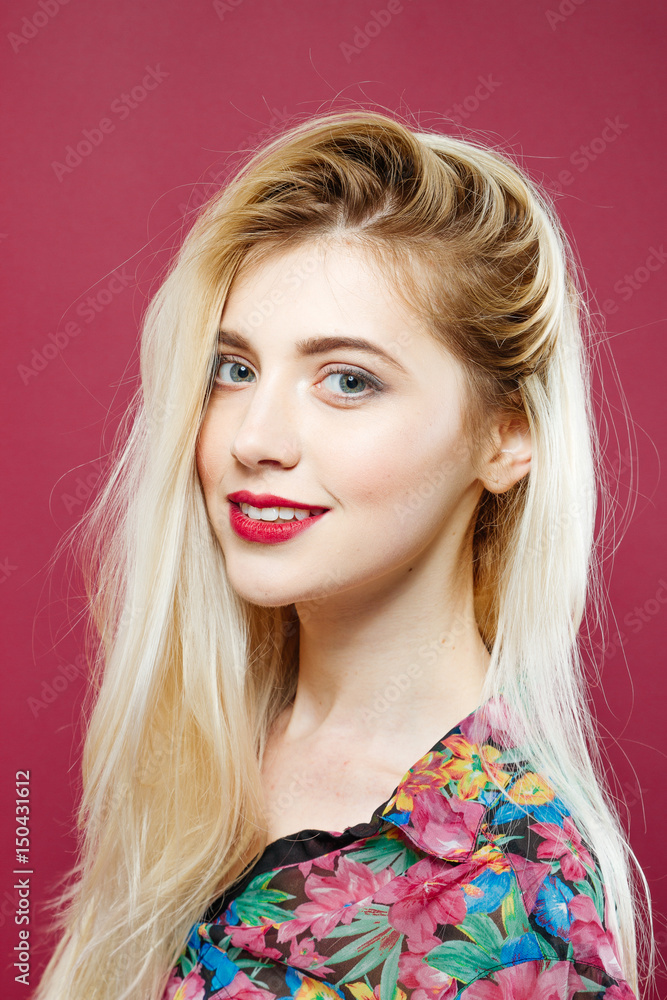 Portrait of Amazing Blonde Looking at the Camera and Smiling on Pink Background in Studio. Portrait of Amazing Blonde Looking at the Camera and Smiling on Pink Background in Studio.