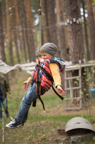 Gomel  Belarus - 30 April  2017  Rope town for a family holiday in the countryside. Family competition to overcome aerial obstacles.