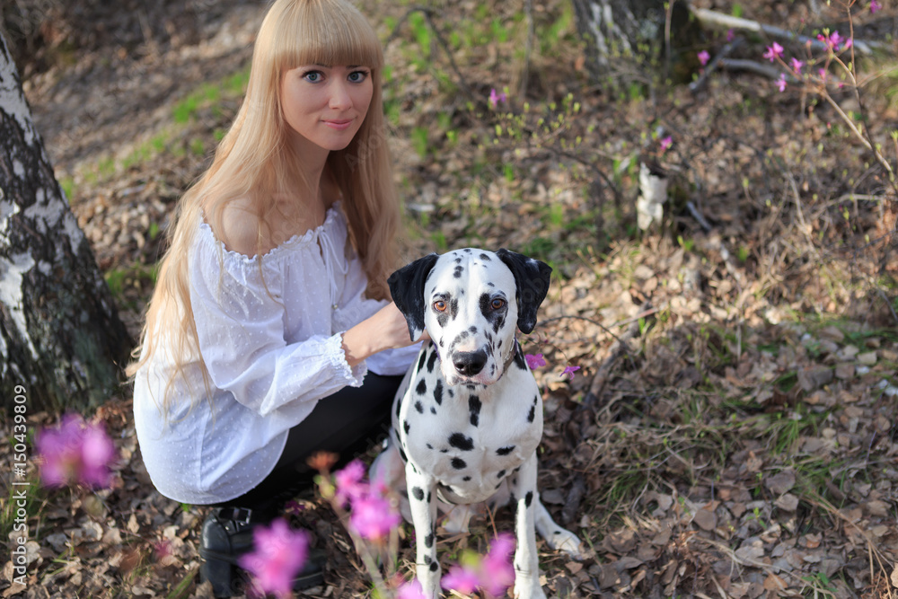 Beautiful woman and his dog posing outside Beautiful woman and his dog posing outside