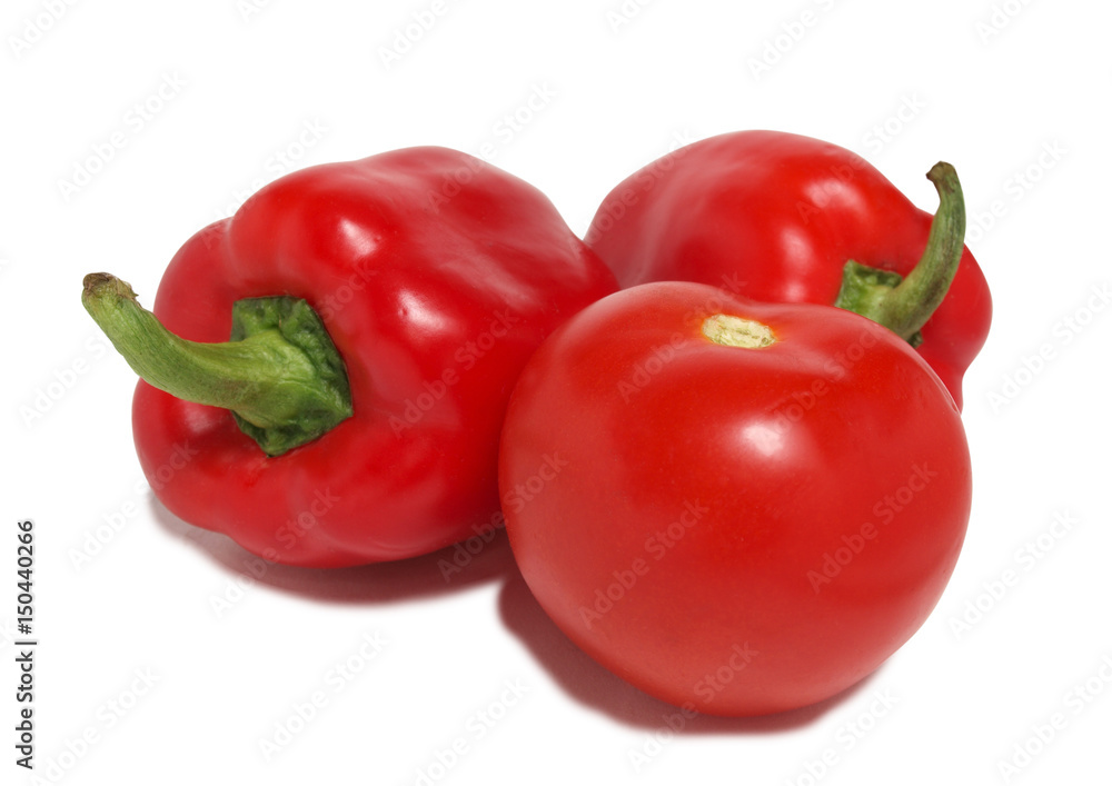 Red tomatoes and peppers on white background Red tomatoes and peppers on white background