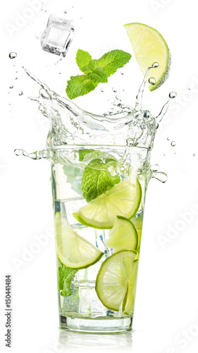 lime and mint falling into a cocktail splashing
