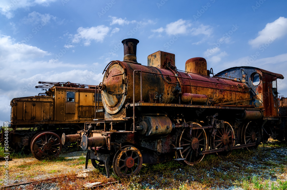 Naklejka premium Rusty old italian steam and electric locomotives 