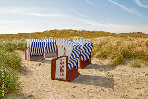 Strandkörbe in Dünenlandschaft photo