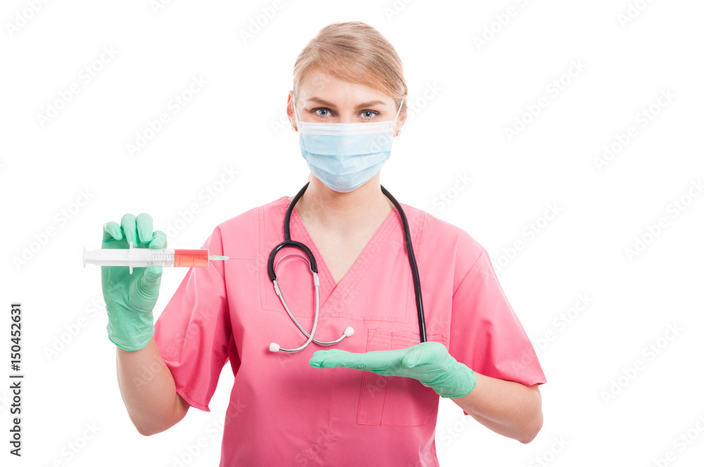 Medical nurse lady showing syringe with red serum Medical nurse lady showing syringe with red serum